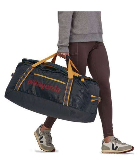 71198564_Patagonia Black Hole Duffel 70L smolder blue w/buckwheat gold