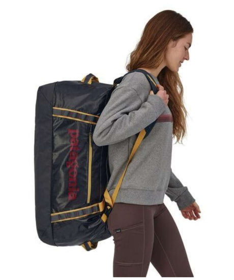 71198564_Patagonia Black Hole Duffel 70L smolder blue w/buckwheat gold