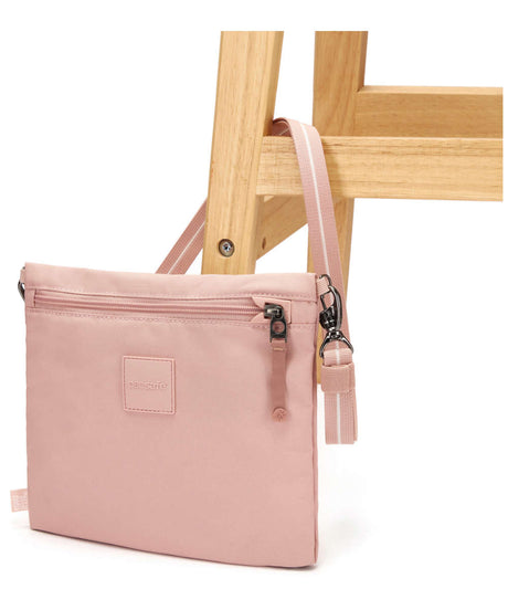 71223736_Pacsafe Go Crossbody Pouch Anti-Diebstahl-Umhängetasche sunset pink